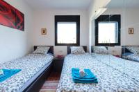 Postel nebo postele na pokoji v ubytování Jie Apartment