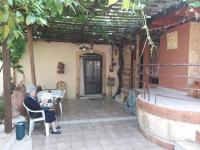A patio or other outdoor area at VLASSIS APTS -ΜΕΛΙΔΟΝΙ-ΔΙΑΜΕΡΙΣΜΑ ΒΑΣΙΛΙΚΗ