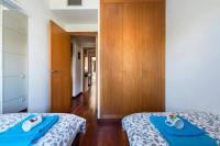 Postel nebo postele na pokoji v ubytování Jie Apartment