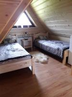 Posteľ alebo postele v izbe v ubytovaní Apartamenty u Bacy