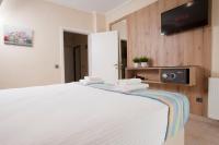Televízia a/alebo spoločenská miestnosť v ubytovaní Seven Heaven Premium Suites
