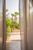 a view from a window with palm trees in the background at Can Jaume by Ocean Drive in Ibiza Town