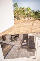 a patio with two chairs and a table and a table and chairs at Can Jaume by Ocean Drive in Ibiza Town