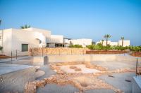 a building with a rock garden in front of a building at Can Jaume by Ocean Drive in Ibiza Town