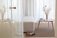 a room with a table and a chair and a table with shoes at Can Jaume by Ocean Drive in Ibiza Town