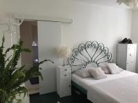 Posteľ alebo postele v izbe v ubytovaní Apartment and Rooms Lapad
