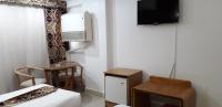 A television and/or entertainment centre at Marhaba Palace Hotel