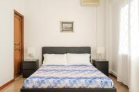 A bed or beds in a room at Cristina Rossi Bed&Breakfast