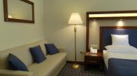 Posteľ alebo postele v izbe v ubytovaní Centrum Hotel