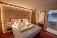 Łóżko lub łóżka w pokoju w obiekcie Hölzl Bed & Breakfast