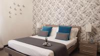 Posteľ alebo postele v izbe v ubytovaní Nobilcasa Suites
