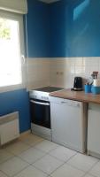 a kitchen with a white stove and a blue wall at Foreword House in Albert