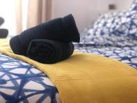 Posteľ alebo postele v izbe v ubytovaní La Costa Penthouse