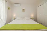 Posteľ alebo postele v izbe v ubytovaní Apartment M&J Supetar