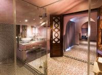 a bathroom with a sink and a mirror at Kenting Amanda Hotel in Nanwan