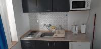 Kuchyň nebo kuchyňský kout v ubytování Apartments Max