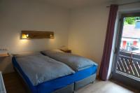 A bed or beds in a room at Haus Peter