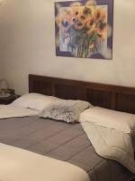 A bed or beds in a room at Casa Paolina - CIPAT 57814