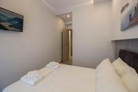 Postel nebo postele na pokoji v ubytování FLOW - White Tower Two Bedroom Suite