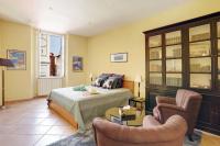 a bedroom with a bed and two chairs at FONTAINE - CHARMING PROVENCAL, Clim, 6 GUEST, OLD TOWN NICE in Nice