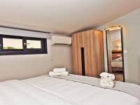 Postel nebo postele na pokoji v ubytování Notos Resort - Tristinika Sithonia