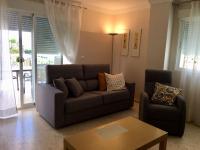 Posedenie v ubytovaní APARTAMENTO CON TERRAZA, VISTAS AL MAR Y PISCINA