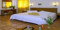 A bed or beds in a room at Sissy Village All Suite Hotel