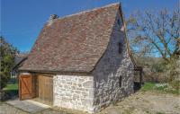 an old stone building with a brown roof and a door at Lovely Home In Padirac With Wifi in Padirac