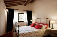A bed or beds in a room at Bosco Ai Marzi