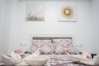 Postel nebo postele na pokoji v ubytování Hostal Goyesco Plaza