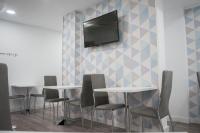 TV a/nebo společenská místnost v ubytování Hostal Goyesco Plaza