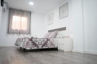 Postel nebo postele na pokoji v ubytování Hostal Goyesco Plaza
