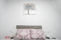 Postel nebo postele na pokoji v ubytování Hostal Goyesco Plaza