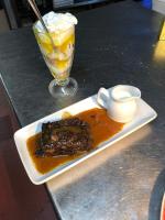 a plate with a piece of cake and a drink at The Old Pound Inn in Langport