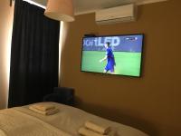 Posteľ alebo postele v izbe v ubytovaní Royal Apartments & Rooms