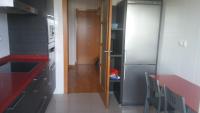 A kitchen or kitchenette at Precioso apartamento