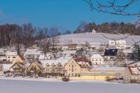 a small town covered in snow with houses at Landhotel Aschenbrenner in Freudenberg