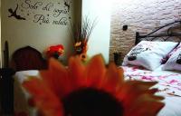 Posteľ alebo postele v izbe v ubytovaní La Casa Dei Sogni