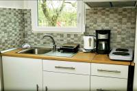 Kuchyň nebo kuchyňský kout v ubytování Cristi Apartments