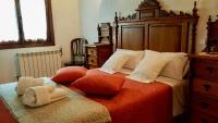 Postel nebo postele na pokoji v ubytování Apartamentos Rurales La Tablá