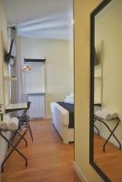 A bed or beds in a room at Good Stay Rooms
