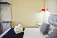 A bed or beds in a room at Good Stay Rooms