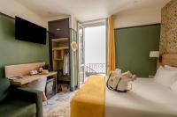Hôtel de France, un hôtel AMMIにあるベッド