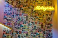 a collage of buildings on the side of a wall at The Melegran in Rovinj