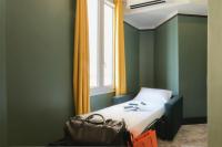 Hôtel de France, un hôtel AMMIにあるベッド