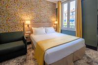 Hôtel de France, un hôtel AMMIにあるベッド