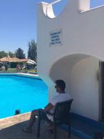 Bazén v ubytování Apartamento 157, Pedras d’el Rei nebo v jeho okolí