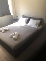A bed or beds in a room at DISTRiCT 01-Luxury Urban Lofts