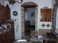 A kitchen or kitchenette at VLASSIS APTS -ΜΕΛΙΔΟΝΙ-ΔΙΑΜΕΡΙΣΜΑ ΒΑΣΙΛΙΚΗ