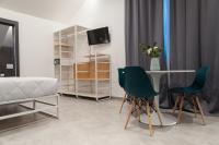 Televízia a/alebo spoločenská miestnosť v ubytovaní Residence Hotel Moderno
